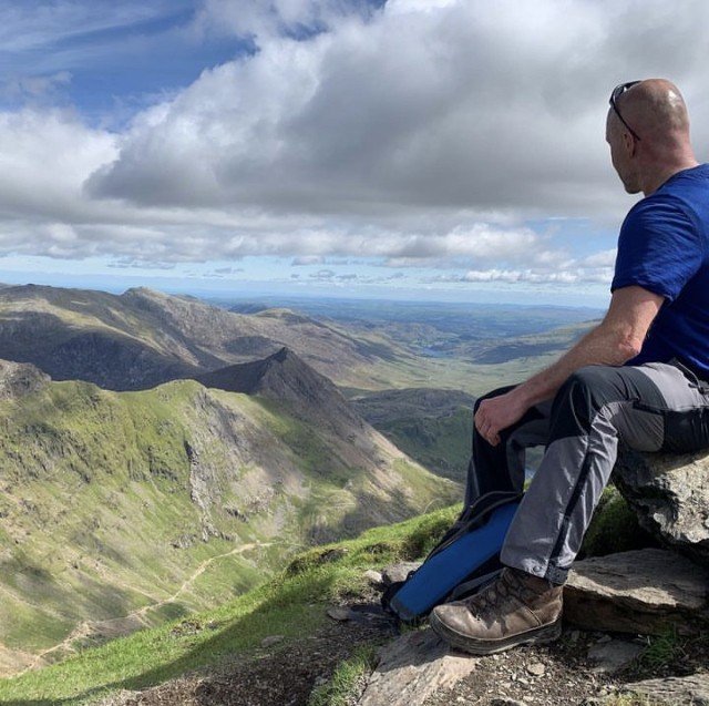 A quiet moment at a mountain summit, looking out over the valley
