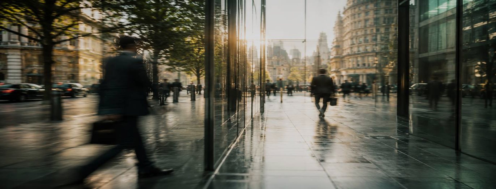 Lawyers walking through the City of London in early morning light
